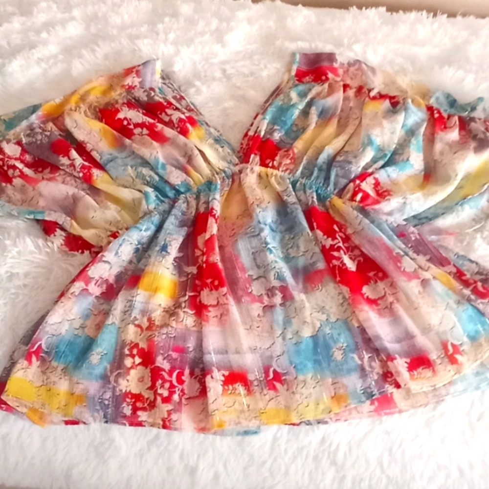 Beautiful and sexy sheer butterfly sleeve top by Bucket List